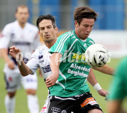 Fussball OEFB Cup. SAK gegen TSV St. Johann/Pongau. Thomas Riedl, (SAK), Armin Gruber  (St.Johann). Klagenfurt, 14.7.2012.
Foto: Kuess
---
pressefotos, pressefotografie, kuess, qs, qspictures, sport, bild, bilder, bilddatenbank