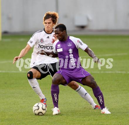 Fussball Testspiel. SK Austria Klagenfurt gegen Besiktas Istanbul. Thierry Fidjeu Tazemeta,  (Austria), Antinc Nukan (Besiktas). Klagenfurt, am 16.7.2012.
Foto: Kuess
---
pressefotos, pressefotografie, kuess, qs, qspictures, sport, bild, bilder, bilddatenbank