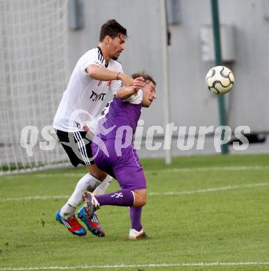 Fussball Testspiel. SK Austria Klagenfurt gegen Besiktas Istanbul. Marc Sand,  (Austria), Ersan Gueluem (Besiktas). Klagenfurt, am 16.7.2012.
Foto: Kuess
---
pressefotos, pressefotografie, kuess, qs, qspictures, sport, bild, bilder, bilddatenbank