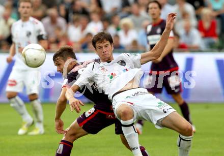 Fussball. Bundesliga. RZ Pellets WAC gegen FK Austria Wien. Christian Falk, (WAC), James Holland (Wien). Wolfsberg, 25.7.2012.
Foto: Kuess


---
pressefotos, pressefotografie, kuess, qs, qspictures, sport, bild, bilder, bilddatenbank