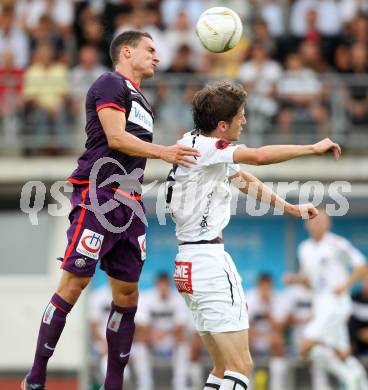 Fussball. Bundesliga. RZ Pellets WAC gegen FK Austria Wien. Christian Falk,  (WAC), Emir Dilaver (Wien). Wolfsberg, 25.7.2012.
Foto: Kuess


---
pressefotos, pressefotografie, kuess, qs, qspictures, sport, bild, bilder, bilddatenbank