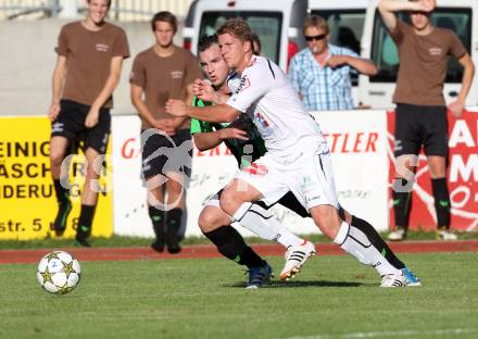 Fussball Freundschaftsspiel. Voelkermarkt gegen RZ Pellets WAC.  Florian Kucher, (Voelkermarkt), Christian Thonhofer  (WAC). Voelkermarkt, am 31.7.2012.
Foto: Kuess

---
pressefotos, pressefotografie, kuess, qs, qspictures, sport, bild, bilder, bilddatenbank