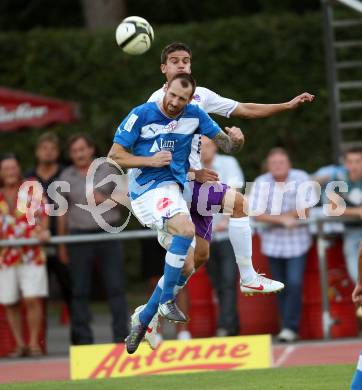 Fussball Regionalliga. VSV gegen SK Austria Klagenfurt. Rok Pavlicic,  (VSV). Siegfried Rasswalder (Austria Klagenfurt). Villach, 24.8.2012.
Foto: Kuess
---
pressefotos, pressefotografie, kuess, qs, qspictures, sport, bild, bilder, bilddatenbank