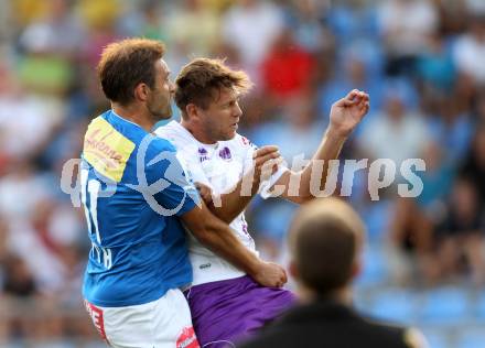 Fussball Regionalliga. VSV gegen SK Austria Klagenfurt. Marco Reich,  (VSV). Boris Huettenbrenner (Austria Klagenfurt). Villach, 24.8.2012.
Foto: Kuess
---
pressefotos, pressefotografie, kuess, qs, qspictures, sport, bild, bilder, bilddatenbank