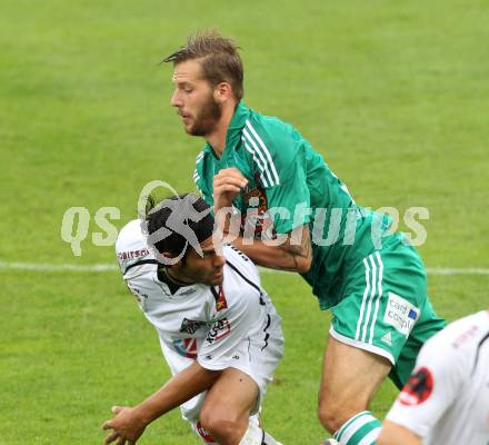 Fussball. Bundesliga. RZ Pellets WAC gegen Rapid Wien. Michele Polverino,  (WAC), Guido Burgstaller (Rapid). Wolfsberg, 26.8.2012.
Foto: Kuess

---
pressefotos, pressefotografie, kuess, qs, qspictures, sport, bild, bilder, bilddatenbank