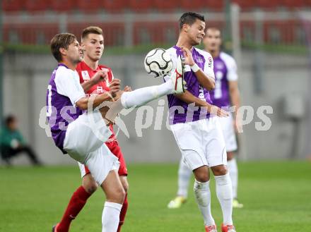 Fussball OEFB Cup. SK Austria Klagenfurt gegen FC Admira Wacker Moedling. Boris Huettenbrenner, Marco Sahanek (Austria), Thorsten Schick (Admira). Klagenfurt, am 25.9.2012.
Foto: Kuess
---
pressefotos, pressefotografie, kuess, qs, qspictures, sport, bild, bilder, bilddatenbank