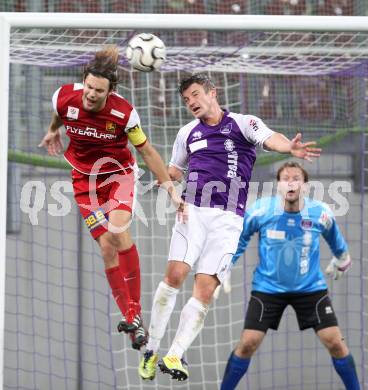 Fussball OEFB Cup. SK Austria Klagenfurt gegen FC Admira Wacker Moedling. Hannes Eder,  (Austria), Richard Windbichler (Admira). Klagenfurt, am 25.9.2012.
Foto: Kuess
---
pressefotos, pressefotografie, kuess, qs, qspictures, sport, bild, bilder, bilddatenbank