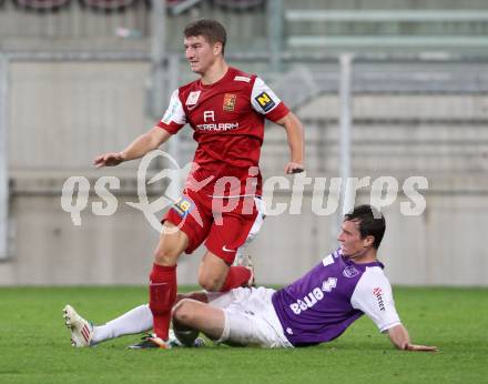 Fussball OEFB Cup. SK Austria Klagenfurt gegen FC Admira Wacker Moedling. Stefan Erkinger, (Austria), Stephan Auer  (Admira). Klagenfurt, am 25.9.2012.
Foto: Kuess
---
pressefotos, pressefotografie, kuess, qs, qspictures, sport, bild, bilder, bilddatenbank