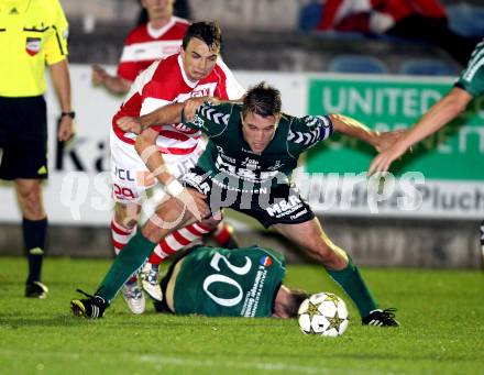 Fussball Regionalliga. Feldkirchen gegen GAK. Mathias Regal, (Feldkirchen), Michael Hofer  (GAK). Feldkirchen, 5.10.2012.
Foto: Kuess
---
pressefotos, pressefotografie, kuess, qs, qspictures, sport, bild, bilder, bilddatenbank