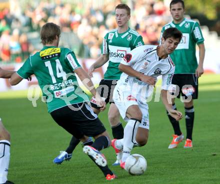 Fussball. Bundesliga. RZ Pellets WAC gegen SV Josko Ried. Mihret Topcagic, (WAC), Jan Marc Riegler  (Ried). Wolfsberg, 6.10.2012.
Foto: Kuess

---
pressefotos, pressefotografie, kuess, qs, qspictures, sport, bild, bilder, bilddatenbank