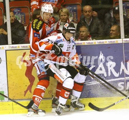 EBEL. Eishockey Bundesliga. EC KAC gegen HC TWK Innsbruck "Die Haie".   Tyler Myers, (KAC), Andreas Hanschitz  (Innsbruck). Klagenfurt, am 21.10.2012.
Foto: Kuess 


---
pressefotos, pressefotografie, kuess, qs, qspictures, sport, bild, bilder, bilddatenbank