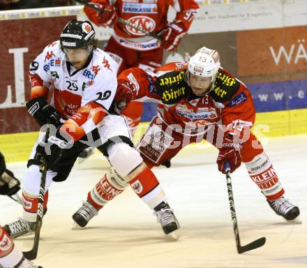 EBEL. Eishockey Bundesliga. EC KAC gegen HC TWK Innsbruck "Die Haie".   Johanns Kirisits, (KAC), Andreas Noedl  (Innsbruck). Klagenfurt, am 21.10.2012.
Foto: Kuess 


---
pressefotos, pressefotografie, kuess, qs, qspictures, sport, bild, bilder, bilddatenbank