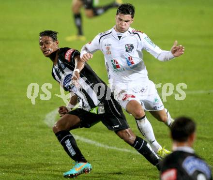 Fussball. Bundesliga. RZ Pellets WAC gegen SK Puntigamer Sturm Graz.  Roland Putsche, (WAC), Ruben Okotie (Graz). Wolfsberg, 27.10.2012.
Foto: Kuess

---
pressefotos, pressefotografie, kuess, qs, qspictures, sport, bild, bilder, bilddatenbank