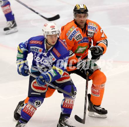 EBEL. Eishockey Bundesliga. EC VSV gegen Moser Medical Graz 99ers.  PUSA Antti (VSV), JARRETT Rodney Coleman (Graz). Villach, am 23.12.2012.
Foto: Kuess 


---
pressefotos, pressefotografie, kuess, qs, qspictures, sport, bild, bilder, bilddatenbank