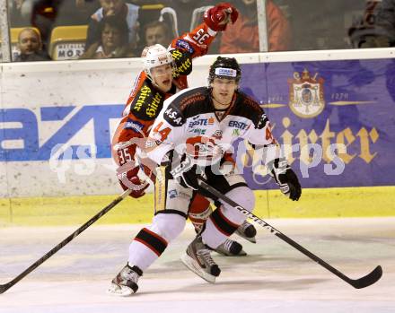 EBEL. Eishockey Bundesliga. EC KAC gegen HC Orli Znojmo.  Nikolaus  Holzer,  (KAC), Burke Henry (Znojmo). Klagenfurt, am 30.12.2012.
Foto: Kuess 


---
pressefotos, pressefotografie, kuess, qs, qspictures, sport, bild, bilder, bilddatenbank