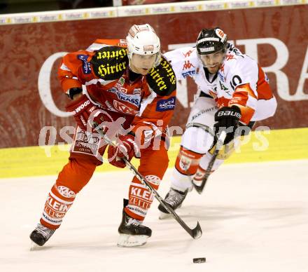 EBEL. Eishockey Bundesliga. EC KAC gegen HC TWK Innsbruck "Die Haie".   Florian Iberer,(KAC),  Patrick Moessmer  (Innsbruck). Klagenfurt, am 15.1.2013.
Foto: Kuess 


---
pressefotos, pressefotografie, kuess, qs, qspictures, sport, bild, bilder, bilddatenbank