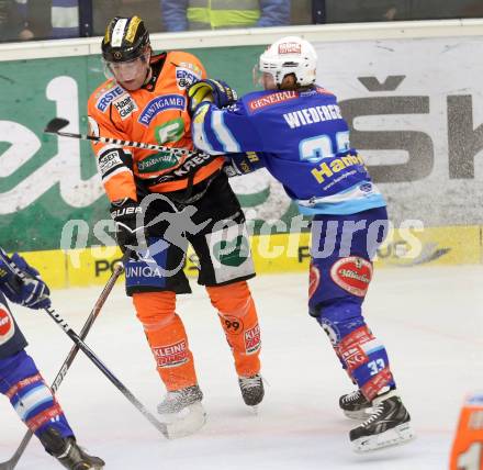 EBEL. Eishockey Bundesliga. EC VSV gegen Moser Medical Graz 99ers.  Andreas Wiedergut,  (VSV), Robert Wren (Graz). Villach, am 31.1.2013.
Foto: Kuess 


---
pressefotos, pressefotografie, kuess, qs, qspictures, sport, bild, bilder, bilddatenbank