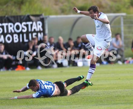 Fussball Testspiel. FK Austria Wien gegen Arminia Bielefeld.  Markus Suttner(Wien), Christian Mueller (Bielefeld). Velden, am 2.7.2013.
Foto: Kuess
---
pressefotos, pressefotografie, kuess, qs, qspictures, sport, bild, bilder, bilddatenbank