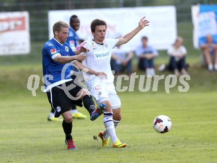 Fussball Testspiel. FK Austria Wien gegen Arminia Bielefeld.  Thomas Murg(Wien), Marc Lorenz (Bielefeld). Velden, am 2.7.2013.
Foto: Kuess
---
pressefotos, pressefotografie, kuess, qs, qspictures, sport, bild, bilder, bilddatenbank