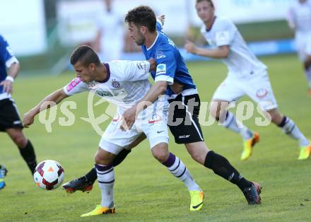 Fussball Testspiel. FK Austria Wien gegen Arminia Bielefeld.  Srdan Spiridonovic (Wien), Dennis Riemer (Bielefeld). Velden, am 2.7.2013.
Foto: Kuess
---
pressefotos, pressefotografie, kuess, qs, qspictures, sport, bild, bilder, bilddatenbank