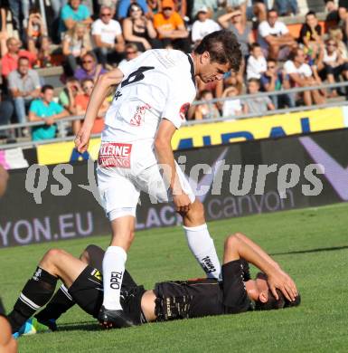 Fussball Bundesliga. RZ Pellets WAC gegen FC Wacker Innsbruck. Christian Falk,  (WAC), Marco Kofler (Innsbruck). Wolfsberg, 10.8.2013.
Foto: Kuess

---
pressefotos, pressefotografie, kuess, qs, qspictures, sport, bild, bilder, bilddatenbank