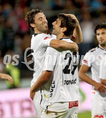 Fussball Bundesliga. RZ Pellets WAC gegen FC Admira Wacker Moedling. Torjubel Joachim Standfest, Mihret Topcagic (WAC). Wolfsberg, 14.9.2013.
Foto: Kuess

---
pressefotos, pressefotografie, kuess, qs, qspictures, sport, bild, bilder, bilddatenbank