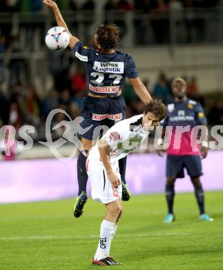 Fussball Bundesliga. RZ Pellets WAC gegen FC Admira Wacker Moedling. Christian Falk,  (WAC), Stefan Schwab (Moedling). Wolfsberg, 14.9.2013.
Foto: Kuess

---
pressefotos, pressefotografie, kuess, qs, qspictures, sport, bild, bilder, bilddatenbank