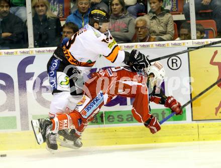 EBEL. Eishockey Bundesliga. KAC gegen Moser Medical Graz 99ers. Thomas Koch, (KAC), Olivier Labelle  (Graz). Klagenfurt, am 22.9.2013
Foto: Kuess 

---
pressefotos, pressefotografie, kuess, qs, qspictures, sport, bild, bilder, bilddatenbank