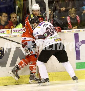 EBEL. Eishockey Bundesliga. KAC gegen SAPA Fehervar AV19. Mihael Filipic, (KAC), Viktor Tokaji  (Alba Volan). Klagenfurt, am 8.10.2013
Foto: Kuess 

---
pressefotos, pressefotografie, kuess, qs, qspictures, sport, bild, bilder, bilddatenbank