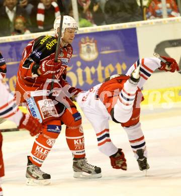 EBEL. Eishockey Bundesliga. KAC gegen EC Red Bull Salzburg. Mike Siklenka,  (KAC), Troy Milam (Salzburg). Klagenfurt, am 13.10.2013
Foto: Kuess 

---
pressefotos, pressefotografie, kuess, qs, qspictures, sport, bild, bilder, bilddatenbank