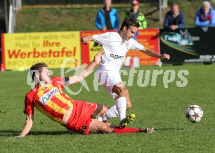 Fussball Kaerntner Liga. ATSV Wolfsberg gegen ATUS Ferlach. Florian Rabensteiner, (Wolfsberg),  Ernst Golautschnig (Ferlach). . Wolfsberg, 13.10.2013.
Foto: Kuess
---
pressefotos, pressefotografie, kuess, qs, qspictures, sport, bild, bilder, bilddatenbank