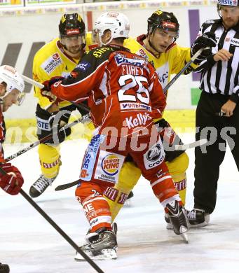 EBEL. Eishockey Bundesliga. KAC gegen UPC Vienna Capitals. Kirk Furey,  (KAC), Mike Ouellette (Caps). Klagenfurt, am 15.10.2013
Foto: Kuess 

---
pressefotos, pressefotografie, kuess, qs, qspictures, sport, bild, bilder, bilddatenbank