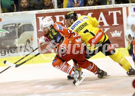 EBEL. Eishockey Bundesliga. KAC gegen UPC Vienna Capitals. Andreas Noedl, (KAC), Adrian Veidemann  (Caps). Klagenfurt, am 27.10.2013
Foto: Kuess 

---
pressefotos, pressefotografie, kuess, qs, qspictures, sport, bild, bilder, bilddatenbank