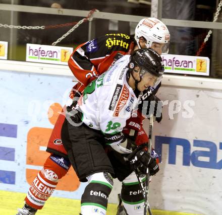 EBEL. Eishockey Bundesliga. KAC gegen HDD TELEMACH Olimpija Ljubljana.  Andreas Noedl, (KAC), Ziga Grahut  (Laibach). Klagenfurt, am 31.10.2013
Foto: Kuess 

---
pressefotos, pressefotografie, kuess, qs, qspictures, sport, bild, bilder, bilddatenbank