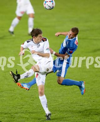 Fussball Bundesliga. RZ Pellets WAC gegen SV Scholz Groedig. Christian Falk, (WAC), Peter Tschernegg (Groedig). Wolfsberg, 2.11.2013.
Foto: Kuess

---
pressefotos, pressefotografie, kuess, qs, qspictures, sport, bild, bilder, bilddatenbank