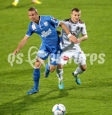 Fussball Bundesliga. RZ Pellets WAC gegen SV Scholz Groedig. Manuel Kerhe, (WAC), Peter Tschernegg (Groedig). Wolfsberg, 2.11.2013.
Foto: Kuess

---
pressefotos, pressefotografie, kuess, qs, qspictures, sport, bild, bilder, bilddatenbank