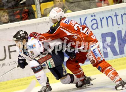 EBEL. Eishockey Bundesliga. KAC gegen SAPA Fehervar AV19.  John Lammers, (KAC), Peter Hetenyi  (Alba Volan). Klagenfurt, am 24.1.2014.
Foto: Kuess 

---
pressefotos, pressefotografie, kuess, qs, qspictures, sport, bild, bilder, bilddatenbank