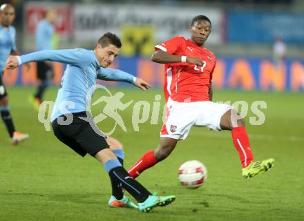 Fussball Laenderspiel. Oesterreich gegen Uruguay. David Alaba, (Oesterreich), Jose Gimenez (Uruguay). Klagenfurt, 5.3.2014.
Foto: Kuess

---
pressefotos, pressefotografie, kuess, qs, qspictures, sport, bild, bilder, bilddatenbank