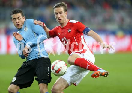 Fussball Laenderspiel. Oesterreich gegen Uruguay. Marc Janko,(Oesterreich),  Jose Gimenez  (Uruguay). Klagenfurt, 5.3.2014.
Foto: Kuess

---
pressefotos, pressefotografie, kuess, qs, qspictures, sport, bild, bilder, bilddatenbank