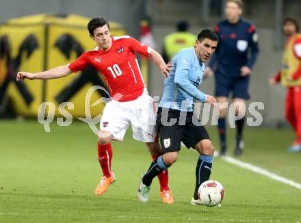 Fussball Laenderspiel. Oesterreich gegen Uruguay. Zlatko Junuzovic, (Oesterreich), Maximiliano Pereira (Uruguay). Klagenfurt, 5.3.2014.
Foto: Kuess

---
pressefotos, pressefotografie, kuess, qs, qspictures, sport, bild, bilder, bilddatenbank