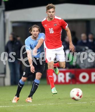 Fussball Laenderspiel. Oesterreich gegen Uruguay. Lukas Hinterseer, (Oesterreich), Gaston Ramirez  (Uruguay). Klagenfurt, 5.3.2014.
Foto: Kuess

---
pressefotos, pressefotografie, kuess, qs, qspictures, sport, bild, bilder, bilddatenbank