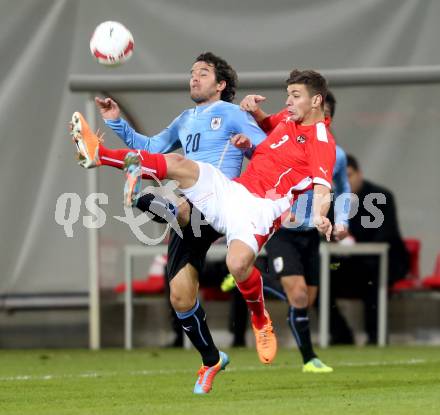 Fussball Laenderspiel. Oesterreich gegen Uruguay. Aleksandar Dragovic, (Oesterreich), Alvaro Gonzalez (Uruguay). Klagenfurt, 5.3.2014.
Foto: Kuess

---
pressefotos, pressefotografie, kuess, qs, qspictures, sport, bild, bilder, bilddatenbank