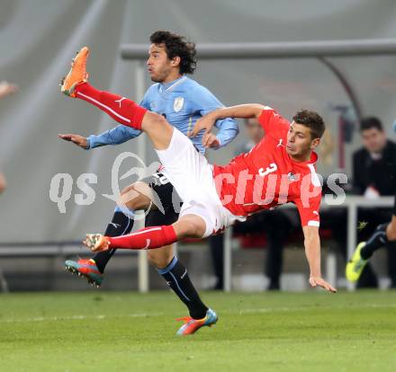 Fussball Laenderspiel. Oesterreich gegen Uruguay. Aleksandar Dragovic, (Oesterreich), Alvaro Gonzalez  (Uruguay). Klagenfurt, 5.3.2014.
Foto: Kuess

---
pressefotos, pressefotografie, kuess, qs, qspictures, sport, bild, bilder, bilddatenbank