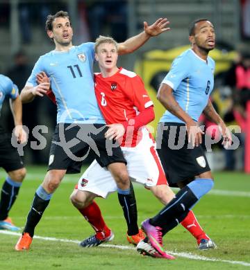 Fussball Laenderspiel. Oesterreich gegen Uruguay. Martin Hinteregger, Oesterreich), Christhia Stuani, Alvaro Pereira( (Uruguay). Klagenfurt, 5.3.2014.
Foto: Kuess

---
pressefotos, pressefotografie, kuess, qs, qspictures, sport, bild, bilder, bilddatenbank