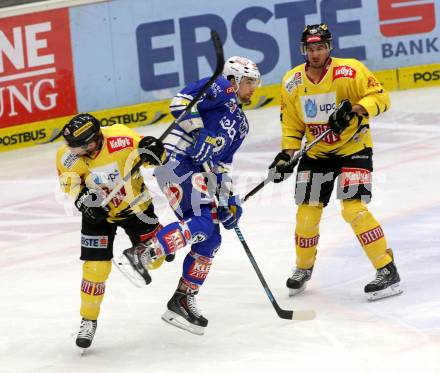 EBEL. Eishockey Bundesliga. EC VSV gegen UPC Vienna Capitals. Eric Hunter,  (VSV), Jamie Fraser (Vienna). Villach, am 9.3.2014.
Foto: Kuess 


---
pressefotos, pressefotografie, kuess, qs, qspictures, sport, bild, bilder, bilddatenbank