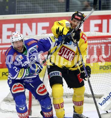 EBEL. Eishockey Bundesliga. EC VSV gegen UPC Vienna Capitals. Cole Jarrett,  (VSV), Kris Beech (Vienna). Villach, am 14.3.2014.
Foto: Kuess 


---
pressefotos, pressefotografie, kuess, qs, qspictures, sport, bild, bilder, bilddatenbank