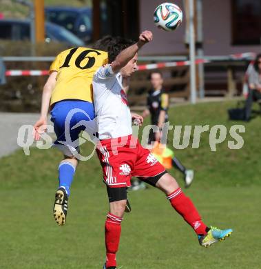 Fussball Unterliga Ost. Ludmannsdorf gegen St. Michael/Bleiburg. Sablatnik Michael (Ludmannsdorf),  Michael Hubert Zidej (St. Michael). Ludmannsdorf, am 30.3.2014.
Foto: Kuess
---
pressefotos, pressefotografie, kuess, qs, qspictures, sport, bild, bilder, bilddatenbank