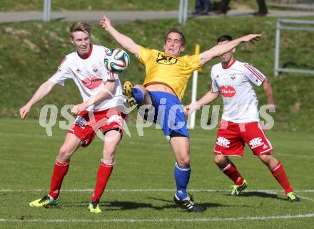 Fussball Unterliga Ost. Ludmannsdorf gegen St. Michael/Bleiburg. Martin Klemenjak  (Ludmannsdorf),  Juergen Galo (St. Michael). Ludmannsdorf, am 30.3.2014.
Foto: Kuess
---
pressefotos, pressefotografie, kuess, qs, qspictures, sport, bild, bilder, bilddatenbank