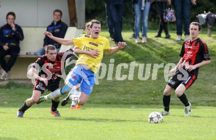 Fussball Unterliga Ost. St. Margarethen/Lav. gegen St. Michael/Lav. Andreas Gressl,  (St. Margarethen), Markus Hubmann (St. Michael). St. Margarethen/Lavanttal, am 12.4.2014.
Foto: Kuess
---
pressefotos, pressefotografie, kuess, qs, qspictures, sport, bild, bilder, bilddatenbank