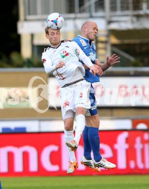 Fussball BUndesliga. RZ Pellets WAC gegen SV Scholz Groedig. Danijel Micic,  (WAC), Hannes Sigurdsson (Groedig). Wolfsberg, am 12.4.2014.
Foto: Kuess

---
pressefotos, pressefotografie, kuess, qs, qspictures, sport, bild, bilder, bilddatenbank